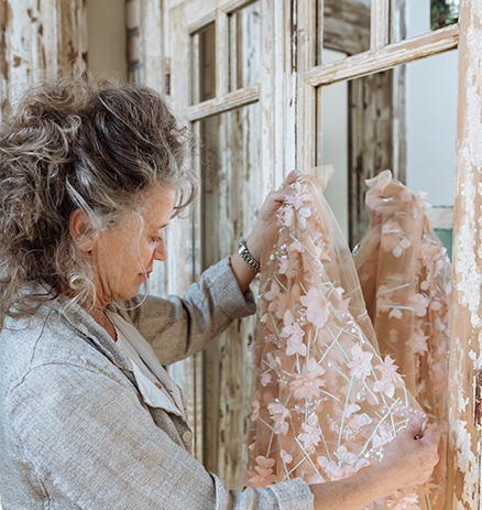 Designer looking at dress alterations